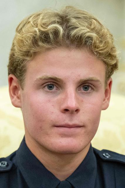 Lifeguard Ryder Williams looks on as he meets with US President Donald Trump in the Oval Office of the White House in Washington, DC, on August 17, 2026. The 16-year-old Williams rescued 10-year-old Nathaniel Rai in rough surf at Seabright Beach last month in Santa Cruz, California. (Photo by Jim WATSON / AFP)