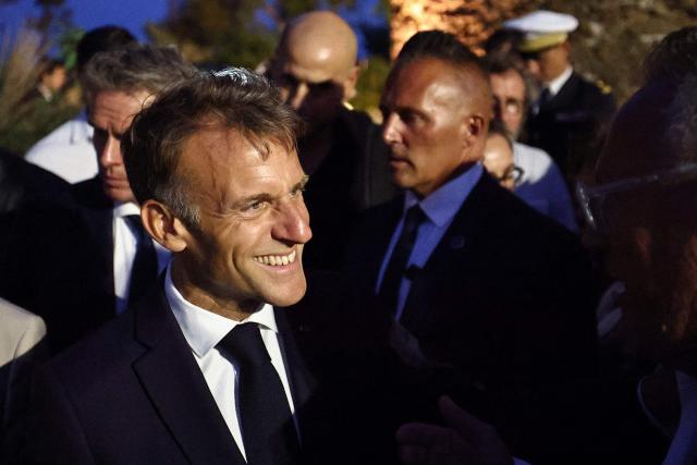 French President Emmanuel Macron reacts following a ceremony commemorating the 82nd anniversary of the Allied 'Operation Dragoon' landings in Provence and the liberation of the village of Bormes-les-Mimosas during World War II, in Bormes-les-Mimosas, southeastern France, on August 17, 2026. (Photo by Manon Cruz / POOL / AFP)