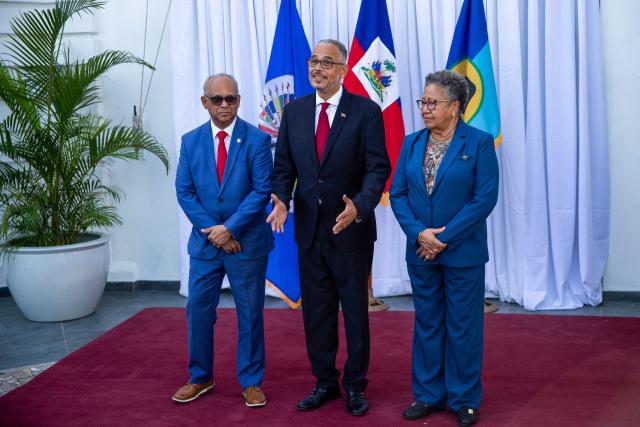 Haiti's Prime Minister Alix Didier Fils-Aime (C) poses with Organization of American States (OAS) Secretary General Albert Ramdin (L) and Caribbean Community (CARICOM)  Secretary General Carla Barnett during their meeting at the National Palace in Port-au-Prince, Haiti, on August 17, 2026. (Photo by Clarens SIFFROY / AFP)