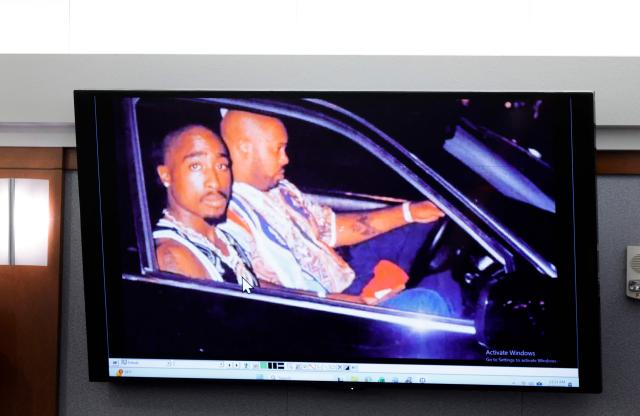 A 1996 photo of rapper Tupac Shukur (L) and Marion “Suge” Knight is  displayed during the Duane Davis murder trial, related to the 1996 killing of the rapper, at Clark County District Court at the Regional Justice Center in Las Vegas, Nevada, on August 17, 2026. The trial of the former gang leader accused of orchestrating the murder of rapper Tupac Shakur began on August 10, 30 years after one of America's most high-profile unresolved killings. The proceedings, expected to last a month, will likely not make clear who fired the shots that killed the California hip-hop legend on the night of September 7, 1996, while he was in Las Vegas to see a Mike Tyson boxing match. (Photo by STEVE MARCUS / POOL / AFP)