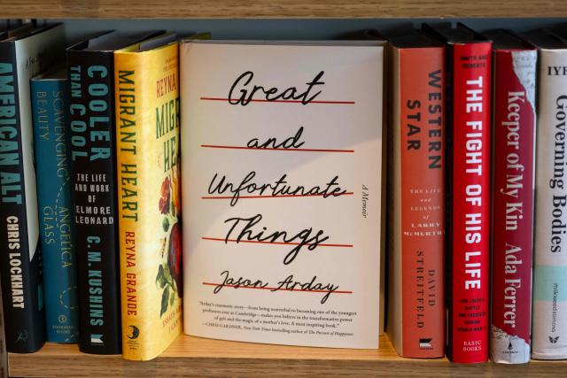 A copy of "Great and Unfortunate Things" by late British academic Jason Arday is displayed on a shelf at a bookstore in Washington, DC, on August 17, 2026. Arday, who became Cambridge's youngest ever black professor when he was appointed in 2023, was found dead on August 14 aged 41, after mounting accusations he had plagiarised parts of his doctoral thesis and exaggerated some of his personal life achievements. (Photo by Kent Nishimura / AFP)