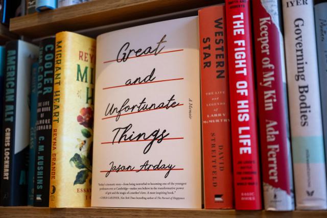 A copy of "Great and Unfortunate Things" by late British academic Jason Arday is displayed on a shelf at a bookstore in Washington, DC, on August 17, 2026. Arday, who became Cambridge's youngest ever black professor when he was appointed in 2023, was found dead on August 14 aged 41, after mounting accusations he had plagiarised parts of his doctoral thesis and exaggerated some of his personal life achievements. (Photo by Kent Nishimura / AFP)