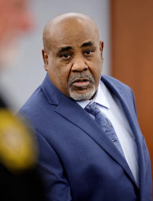Duane Davis enters the courtroom after a break in his murder trial, related to the 1996 killing of rapper Tupac Shakur, at Clark County District Court at the Regional Justice Center in Las Vegas, Nevada, on August 17, 2026. The trial of the former gang leader accused of orchestrating the murder of rapper Tupac Shakur began on August 10, 30 years after one of America's most high-profile unresolved killings. The proceedings, expected to last a month, will likely not make clear who fired the shots that killed the California hip-hop legend on the night of September 7, 1996, while he was in Las Vegas to see a Mike Tyson boxing match. (Photo by STEVE MARCUS / POOL / AFP)