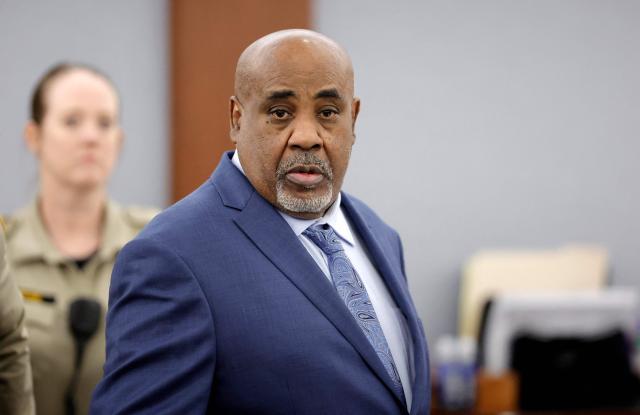 Duane Davis enters the courtroom after a break in his murder trial, related to the 1996 killing of rapper Tupac Shakur, at Clark County District Court at the Regional Justice Center in Las Vegas, Nevada, on August 17, 2026. The trial of the former gang leader accused of orchestrating the murder of rapper Tupac Shakur began on August 10, 30 years after one of America's most high-profile unresolved killings. The proceedings, expected to last a month, will likely not make clear who fired the shots that killed the California hip-hop legend on the night of September 7, 1996, while he was in Las Vegas to see a Mike Tyson boxing match. (Photo by STEVE MARCUS / POOL / AFP)