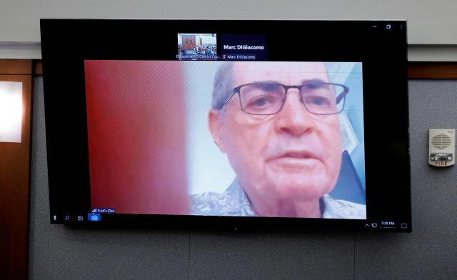 Fred Miller, a retired Los Angeles Police Department homicide detective, testifies by video feed during Duane Davis murder trial, related to the 1996 killing of rapper Tupac Shakur, at Clark County District Court at the Regional Justice Center in Las Vegas, Nevada, on August 17, 2026. The trial of the former gang leader accused of orchestrating the murder of rapper Tupac Shakur began on August 10, 30 years after one of America's most high-profile unresolved killings. The proceedings, expected to last a month, will likely not make clear who fired the shots that killed the California hip-hop legend on the night of September 7, 1996, while he was in Las Vegas to see a Mike Tyson boxing match. (Photo by STEVE MARCUS / POOL / AFP)