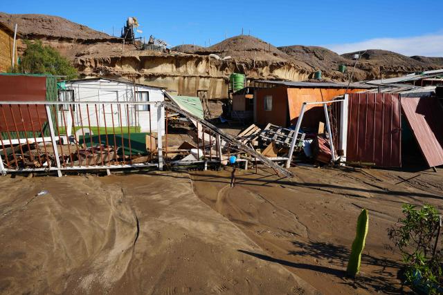 Debris of a house are pictured after a mudslide following heavy rains in Puerto Viejo, Caldera commune, Atacama region, Chile on August 17, 2026. (Photo by Patricio BANDA / AFP)