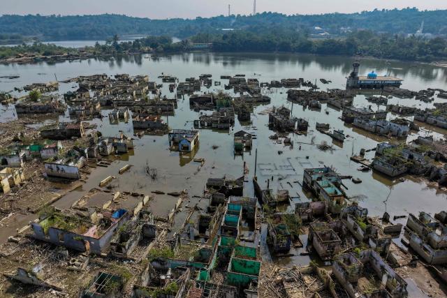 (FILES) An aerial view taken on July 30, 2026 shows Somang village in Lebak in Indonesia's western Banten province, which was deliberately flooded to make way for the construction and filling of the Karian Dam that opened in 2023 and has now re-emerged due to the El Nino-driven drought. Indonesia believes cloud seeding can help it tackle a wildfire season that experts say is on track to be among the worst in years, driven by a strong El Nino. (Photo by BAY ISMOYO / AFP)