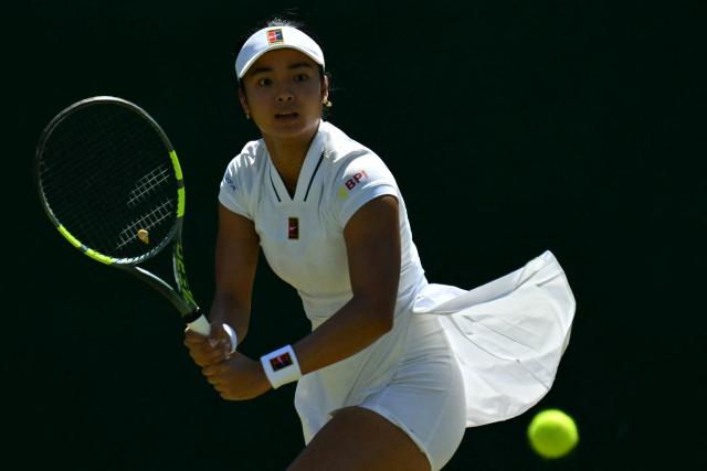 (FILES) Philippines' Alexandra Eala returns to Australia's Maya Joint during their women's singles second round tennis match on the fourth day of the 2026 Wimbledon Championships at The All England Lawn Tennis and Croquet Club in Wimbledon, southwest London, on July 2, 2026. The Asian Games begin in Japan on September 19, 2026 featuring teenage prodigies, more athletes than the Olympics and a cruise ship that will house competitors in the middle of typhoon season. (Photo by Glyn KIRK / AFP)