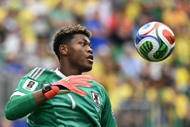 (FILES) Japan's goalkeeper Zion Suzuki eyes the ball during the 2026 World Cup round of 32 football match between Brazil and Japan at the Houston Stadium in Houston on June 29, 2026. Zion Suzuki has had to overcome costly mistakes and racist abuse on the way to becoming the most expensive Japanese goalkeeper in history. The 23-year-old is reportedly set to join Premier League Aston Villa from Italian team Parma for up to 35 million euros ($40 million) following an impressive World Cup. (Photo by Paul ELLIS / AFP)