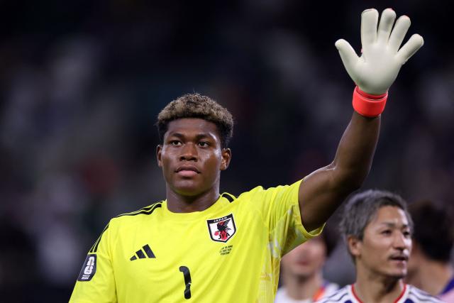 (FILES) Japan's goalkeeper Zion Suzuki celebrates at the end of the 2026 World Cup Group F football match between Tunisia and Japan at the Monterrey Stadium in Guadalupe, Mexico, on June 20, 2026. Zion Suzuki has had to overcome costly mistakes and racist abuse on the way to becoming the most expensive Japanese goalkeeper in history. The 23-year-old is reportedly set to join Premier League Aston Villa from Italian team Parma for up to 35 million euros ($40 million) following an impressive World Cup. (Photo by Julio Cesar AGUILAR / AFP)