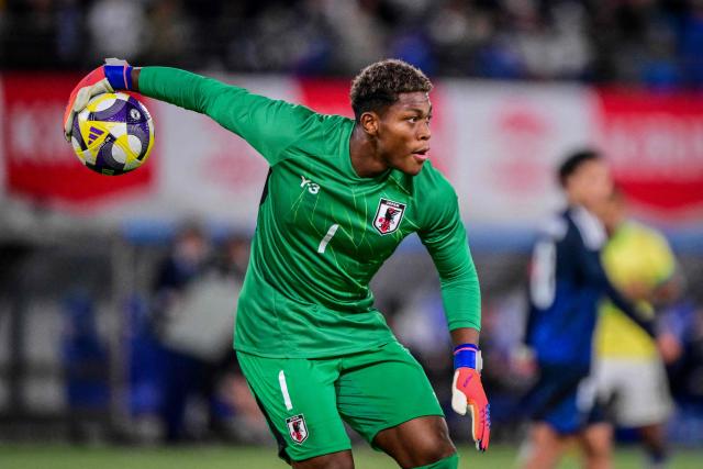 (FILES) Japan’s goalkeeper Zion Suzuki throws the ball during the international football friendly match between Japan and Brazil at the Tokyo stadium in Chofu, Tokyo prefecture on October 14, 2025. Zion Suzuki has had to overcome costly mistakes and racist abuse on the way to becoming the most expensive Japanese goalkeeper in history. The 23-year-old is reportedly set to join Premier League Aston Villa from Italian team Parma for up to 35 million euros ($40 million) following an impressive World Cup. (Photo by Yuichi YAMAZAKI / AFP)