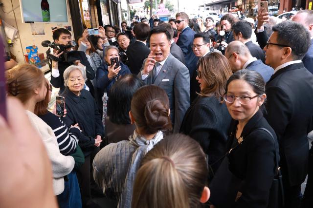 Thailand's Prime Minister Anutin Charnvirakul (C) reacts as he walk with officials during a visit to Thaitown in Sydney on August 18, 2026. The Thai Prime Minister is on a three-day official visit to Australia. (Photo by DAVID GRAY / AFP)