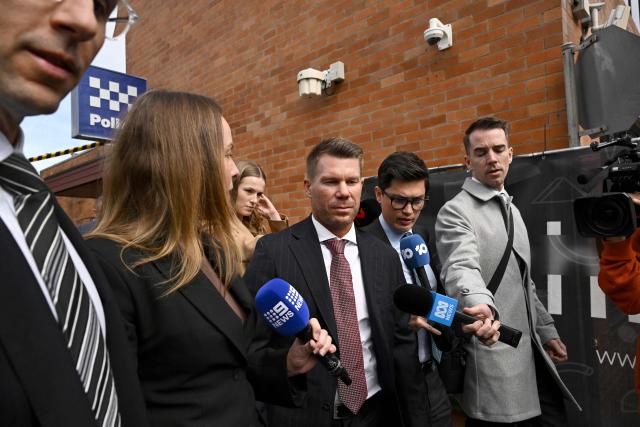 Australia's former cricketer David Warner (C) leaves Waverley Local Court in Sydney on August 18, 2026, after being fined and ordered to use a vehicle breathalyser lock following his admission to a drink-driving offence. Warner, a world-renowned former opening batsman for Australia, pleaded guilty last month to a "middle range" drink-driving offence. (Photo by Saeed KHAN / AFP)