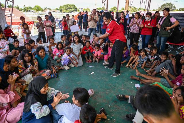 Children participate in a trauma healing programme at a shelter in Maumere, East Nusa Tenggara, on August 18, 2026, following a 7.7-magnitude earthquake that struck Indonesia's Flores island on August 15. Thousands of people displaced by a powerful earthquake in eastern Indonesia awaited much-needed aid on August 17 as they camped out at schools, police stations and government offices, with many stuck outside. (Photo by JUNI KRISWANTO / AFP)