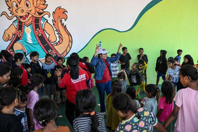 Children participate in a trauma healing programme at a shelter in Maumere, East Nusa Tenggara, on August 18, 2026, following a 7.7-magnitude earthquake that struck Indonesia's Flores island on August 15. Thousands of people displaced by a powerful earthquake in eastern Indonesia awaited much-needed aid on August 17 as they camped out at schools, police stations and government offices, with many stuck outside. (Photo by JUNI KRISWANTO / AFP)