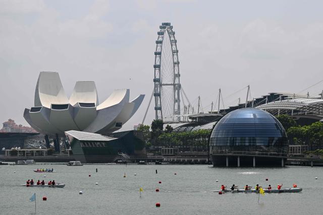 Rowers compete in an outrigger canoe race during the Singapore Va'a World Sprints Championships 2026 in Marina Bay in Singapore on August 18, 2026. (Photo by Roslan RAHMAN / AFP)
