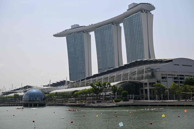 Rowers compete in an outrigger canoe race during the Singapore Va'a World Sprints Championships 2026 in Marina Bay in Singapore on August 18, 2026. (Photo by Roslan RAHMAN / AFP)