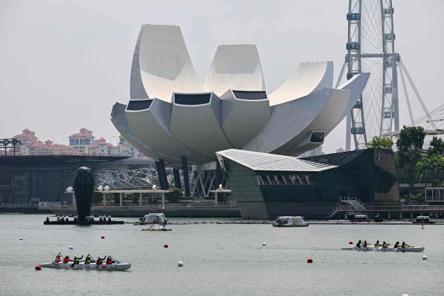 Rowers compete in an outrigger canoe race during the Singapore Va'a World Sprints Championships 2026 in Marina Bay in Singapore on August 18, 2026. (Photo by Roslan RAHMAN / AFP)