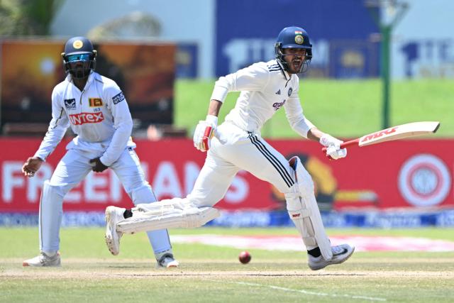 India's Shubman Gill (R) runs between the wickets during the fourth day of the first Test cricket match between Sri Lanka and India at the Galle International Stadium in Galle on August 18, 2026. (Photo by Ishara S. KODIKARA / AFP)