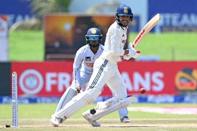 India's captain Shubman Gill (R) plays a shot during the fourth day of the first Test cricket match between Sri Lanka and India at the Galle International Stadium in Galle on August 18, 2026. (Photo by Ishara S. KODIKARA / AFP)