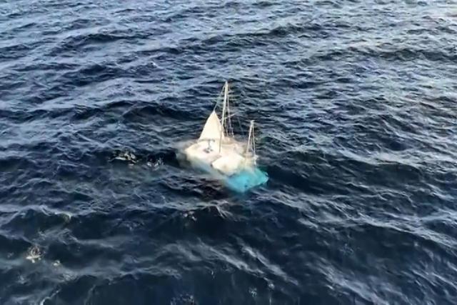 This video grab shows a drifting sailboat, filmed from a ferry off the coast of French island of Ile-d'Yeu, western Franc on August 17, 2026 as search operations are underway to try to locate its occupants. The alarm was raised by a passenger on a Brittany Ferries vessel, travelling between Portsmouth (UK) and Bilbao (Spain), who "spotted a drifting sailboat." (Photo by John WEAVER / AFP)