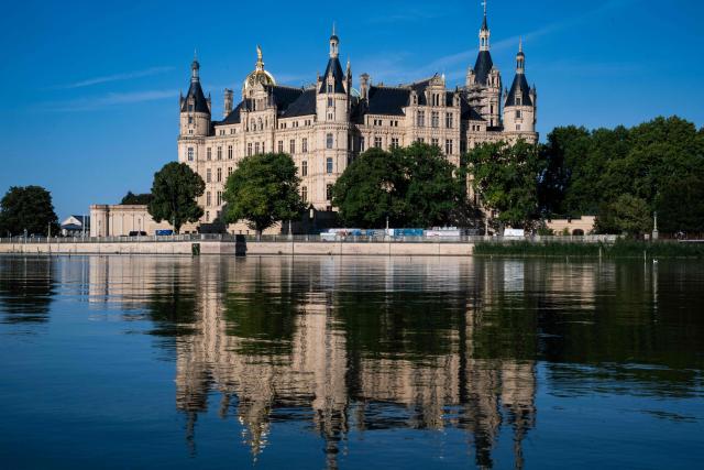 View of the Schwerin Palace taken on August 14, in Schwerin, northern Germany. The palace, built in the 19th Century to replace an earlier castle, houses the state parliament of the state of Mecklenburg-West Pomerania since the 1990s. (Photo by John MACDOUGALL / AFP)