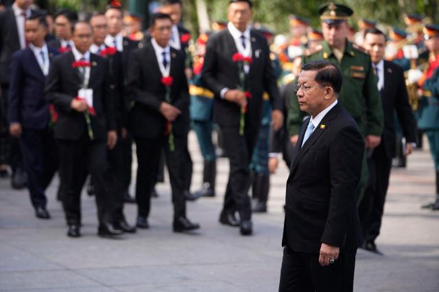 Myanmar's President Min Aung Hlaing looks on as he attends a wreath-laying ceremony at the Tomb of the Unknown Soldier near the Kremlin wall in Moscow on August 18, 2026. (Photo by Pavel Bednyakov / POOL / AFP)