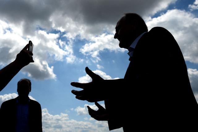 (FILES) Joachim Rukwied, President of the German Farmers' Association (Deutscher Bauernverband) answers a journalist during a press event marking the official start of the 2026 grain harvest in Gross Machnow, eastern Germany, on July 2, 2026. Germany's grain harvest is expected to fall by seven percent this year as a result of severe drought and heatwaves, the German Farmers' Association (DBV) warned on August 18, 2026. "An overly dry spring and a heatwave in the second half of June were defining factors" leading to what the group described as a "below-average grain harvest" forecast at 41.9 million tonnes. Germany, along with much of Europe, has seen record-breaking temperatures this summer along with limited rainfall in much of the country. (Photo by RALF HIRSCHBERGER / AFP)