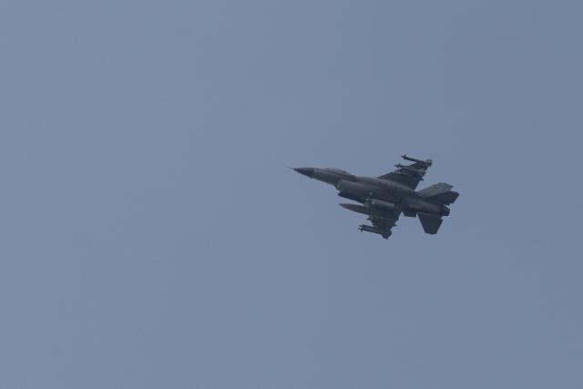 An F-16 fighter jet flies in the sky over Kyiv on August 18, 2026, amid the Russian invasion of Ukraine. (Photo by Roman PILIPEY / AFP)