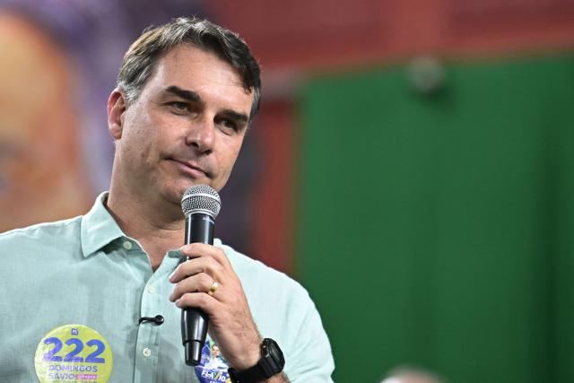 Senator and right-wing presidential candidate Flavio Bolsonaro speaks to supporters during a rally at Mackenzie Esporte Clube in Belo Horizonte, Brazil on August 17, 2026. Brazilians will go to the polls next October 4 once again deeply polarized and under the shadow of US President Donald Trump, who has backed conservative candidates in recent elections in Latin America. (Photo by Gledston Tavares / AFP)