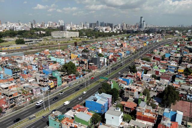(FILES) This aerial view shows the Padre Carlos Mujica shantytown -aka Villa 31- in Buenos Aires, on February 26, 2026. Household arrears in Argentina have tripled in twelve months and reached in 2026 their highest level in 20 years during Javier Milei’s government. The main problem is stagnant incomes and soaring living costs, particularly due to utility bills, which have far outstripped inflation since the ultra-liberal president came to power in December 2023. (Photo by LUIS ROBAYO / AFP)