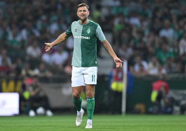 (FILES) Bremen's German forward #11 Niclas Fuellkrug reacts during the German first division Bundesliga football match between Werder Bremen and FC Bayern Munich in Bremen, northern Germany, on August 18, 2023. Three years after leaving the club, forward Niclas Füllkrug is set to return to Werder Bremen on a one-season loan from West Ham, the German club announced on August 18, 2026. (Photo by INA FASSBENDER / AFP) / DFL REGULATIONS PROHIBIT ANY USE OF PHOTOGRAPHS AS IMAGE SEQUENCES AND/OR QUASI-VIDEO