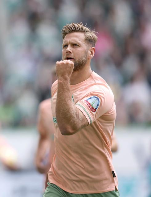 (FILES) Bremen's German forward Niclas Fuellkrug celebrates the 1-1 during the German first division Bundesliga football match between VfL Wolfsburg and Werder Bremen in Wolfsburg, Germany, on August 6, 2022. Three years after leaving the club, forward Niclas Füllkrug is set to return to Werder Bremen on a one-season loan from West Ham, the German club announced on August 18, 2026. (Photo by Ronny Hartmann / AFP) / DFL REGULATIONS PROHIBIT ANY USE OF PHOTOGRAPHS AS IMAGE SEQUENCES AND/OR QUASI-VIDEO