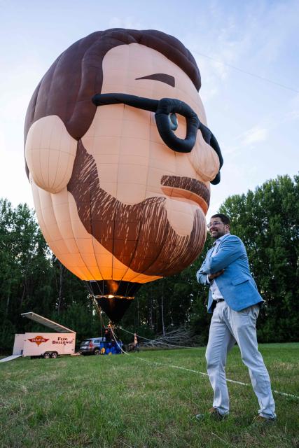 Sweden Democrats party leader Jimmie Akesson stands in front of a giant air balloon depicting his image during his election campaign in Norsborg, near Stockholm, on August 18, 2026, ahead of Sweden’s general election in September. (Photo by Jonathan NACKSTRAND / AFP)