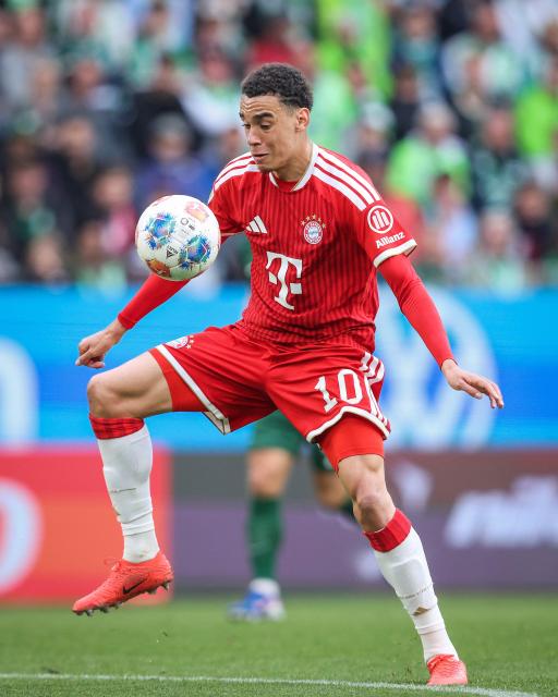 (FILES) Bayern Munich's German midfielder #10 Jamal Musiala plays the ball during the German first division Bundesliga football match between VfL Wolfsburg and FC Bayern Munich in Wolfsburg, on May 9, 2026. Bayern Munich midfielder Jamal Musiala was taken off the pitch after collapsing in a pre-season friendly on August 18, 2026, three days after a similar incident in Munich. (Photo by Ronny HARTMANN / AFP)