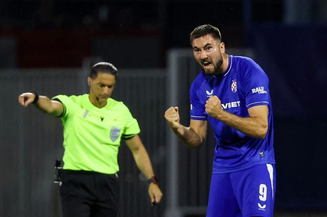 Dinamo's Croatian forward Dion Beljo #9 (R) celebrates after scoring his team's first goal during the UEFA Championship 1st leg Play-off football match between GNK Dinamo Zagreb and Viking FC at stadium Maksimir in Zagreb, Croatia on August 18, 2026. (Photo by MARKO PERKOV / AFP)
