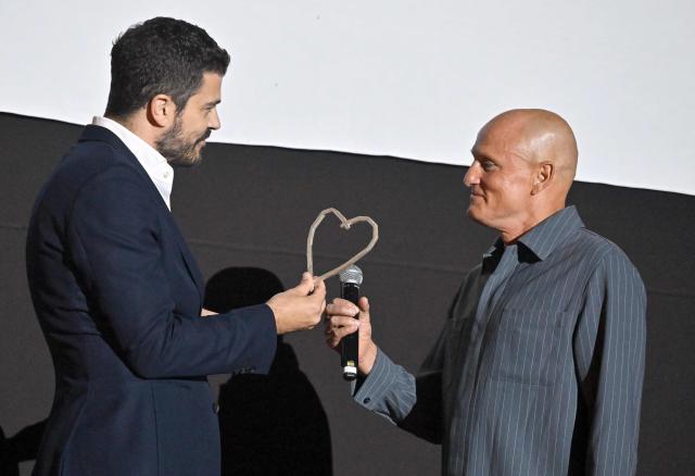 US actor Woody Harrelson (R) receives his "Heart Of Sarajevo" award from Director of Sarajevo Film Festival, Jovan Marjanovic (L),  at the 32nd Sarajevo Film Festival in Sarajevo, Bosnia and Herzegovina, on August 18, 2026. (Photo by ELVIS BARUKCIC / AFP)