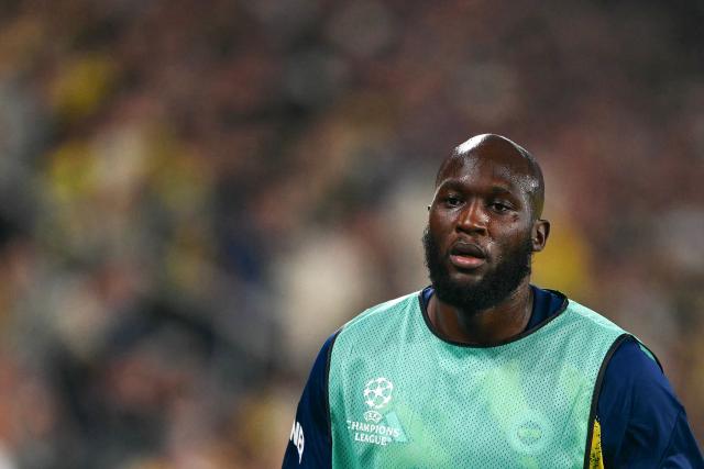 Fenerbahce's Belgian forward #09 Romelu Lukaku looks on as he warms up during the UEFA Champions League qualifying playoff - first leg football match between Fenerbahce SK and Olympique Lyonnais (OL) at the Sukru Saracoglu Stadium in Istanbul on August 18, 2026. (Photo by YASIN AKGUL / AFP)