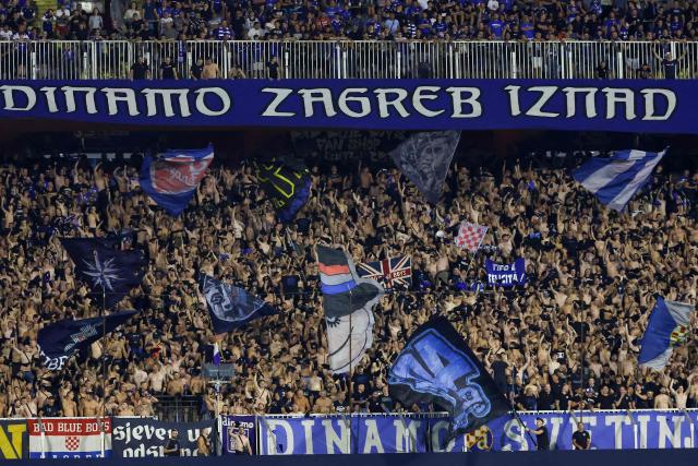 Dinamo's supporters Bad Blue Boys cheer on their team uring the UEFA Championship 1st leg Play-off football match between GNK Dinamo Zagreb and Viking FC at stadium Maksimir in Zagreb, Croatia on August 18, 2026. (Photo by MARKO PERKOV / AFP)