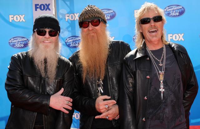 (FILES) This photo taken May 21, 2008, shows ZZ Top band members Dusty Hill (L), Billy Gibbons (C) and Frank Beard (R) arriving for the American Idol 2008 Finale held at the Nokia theatre in Los Angeles. Frank Beard, the longtime drummer of American rock-blues group ZZ Top, has died at the age of 77, the band and their publicist announced August 18. Beard, whose beats carried hits like "La Grange" and "Sharp Dressed Man," had stepped back from touring last year after suffering (Photo by Chris Delmas / AFP)