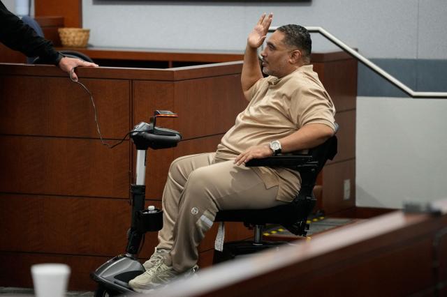 Reggie Wright Jr., the security chief for Death Row Records, is sworn in prior to testify during the murder trial of Duane Davis related to the 1996 killing of rapper Tupac Shakur, at Clark County District Court Regional Justice Center in Las Vegas, Nevada, on August 18, 2026. The trial of the former gang leader accused of orchestrating the murder of rapper Tupac Shakur began on August 10, 30 years after one of America's most high-profile unresolved killings. The proceedings, expected to last a month, will likely not make clear who fired the shots that killed the California hip-hop legend on the night of September 7, 1996, while he was in Las Vegas to see a Mike Tyson boxing match. (Photo by John Locher / POOL / AFP)