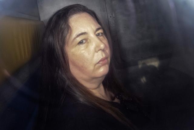 (FILES) This picture taken on May 12, 2025 shows Erin Patterson arriving in the back of a prison transport vehicle at Latrobe Valley Magistrate's Court in Morwell, Australia. Australian toxic mushroom killer Erin Patterson's bid to overturn her conviction in a triple-murder case kicked off on August 19, 2026 at a court in Melbourne, according to an official livestream of the proceedings. (Photo by Martin KEEP / AFP) / For any use in Australia and New Zealand, please contact the AFP sales department at sydsales@afp.com or +61 405 149 534.