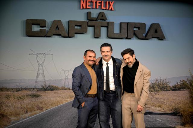(L to R) Mexican actors Noe Hernandez, Alfonso Herrera, and Hector Kotsifakis pose on the red carpet upon arrival to attend the premiere of the film "La Captura" (or "Facing El Chapo") in Mexico City on August 18, 2026. (Photo by Alfredo ESTRELLA / AFP)
