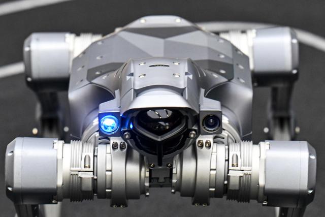 A remote-controlled robot by Unitree Robotics is displayed at the Unitree Robotics Embodied Intelligence Experience Center in the Jing'an district in Shanghai on August 19, 2026. Shares in Chinese robotics pioneer Unitree soared more than 600 percent on its debut in Shanghai on August 19, after raising more than $900 million in its initial public offering. (Photo by Hector RETAMAL / AFP)
