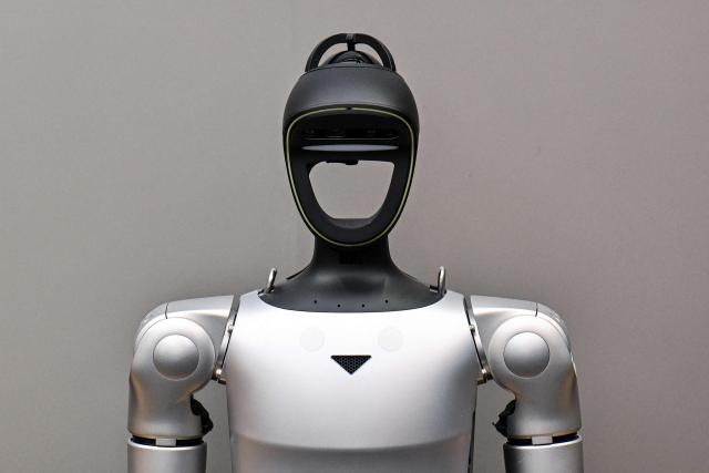 A remote-controlled robot by Unitree Robotics is displayed at the Unitree Robotics Embodied Intelligence Experience Center in the Jing'an district in Shanghai on August 19, 2026. Shares in Chinese robotics pioneer Unitree soared more than 600 percent on its debut in Shanghai on August 19, after raising more than $900 million in its initial public offering. (Photo by Hector RETAMAL / AFP)