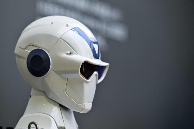 A remote-controlled robot by Unitree Robotics is displayed at the Unitree Robotics Embodied Intelligence Experience Center in the Jing'an district in Shanghai on August 19, 2026. Shares in Chinese robotics pioneer Unitree soared more than 600 percent on its debut in Shanghai on August 19, after raising more than $900 million in its initial public offering. (Photo by Hector RETAMAL / AFP)