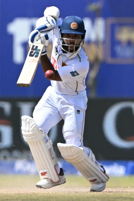 Sri Lanka's Sonal Dinusha plays a shot during the fifth day of the first Test cricket match between Sri Lanka and India at the Galle International Stadium in Galle on August 19, 2026. (Photo by Ishara S. KODIKARA / AFP)