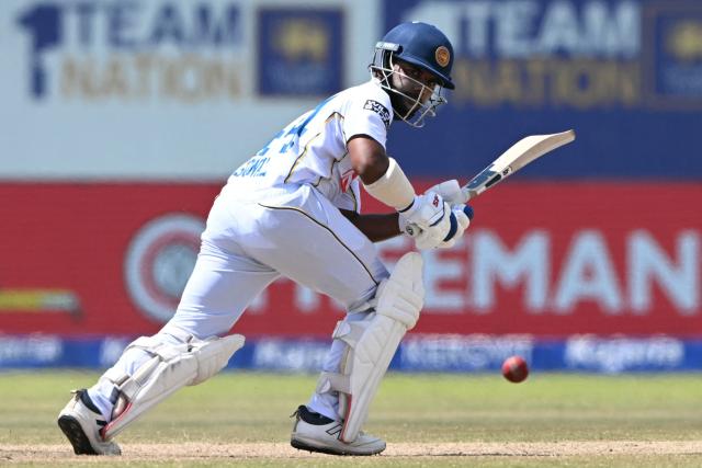 Sri Lanka's Sonal Dinusha plays a shot during the fifth day of the first Test cricket match between Sri Lanka and India at the Galle International Stadium in Galle on August 19, 2026. (Photo by Ishara S. KODIKARA / AFP)