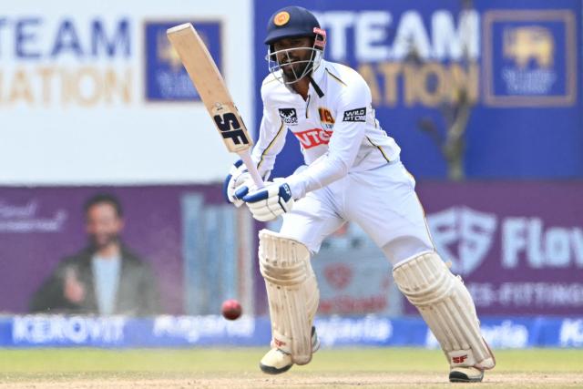 Sri Lanka's captain Dhananjaya de Silva plays a shot during the fifth day of the first Test cricket match between Sri Lanka and India at the Galle International Stadium in Galle on August 19, 2026. (Photo by Ishara S. KODIKARA / AFP)
