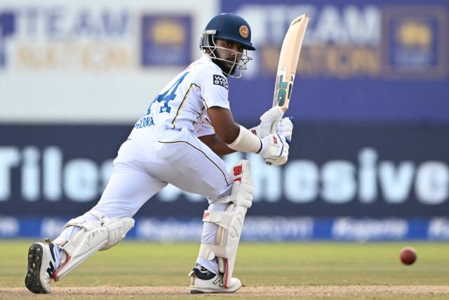 Sri Lanka's Sonal Dinusha plays a shot during the fifth day of the first Test cricket match between Sri Lanka and India at the Galle International Stadium in Galle on August 19, 2026. (Photo by Ishara S. KODIKARA / AFP)